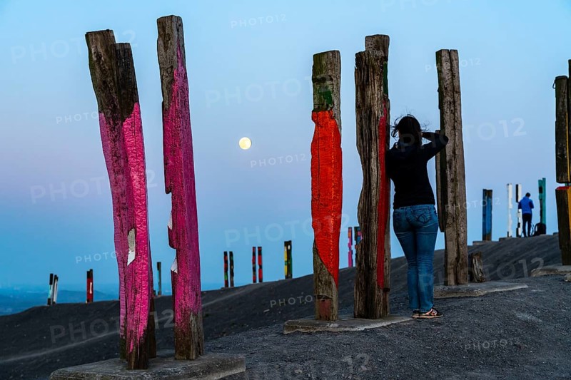 The Haniel spoil tip, 185 metre high spoil tip, at the Prosper Haniel mine, closed in 2019, artwork Totems by the sculptor Augustin Ibarrola, full moon, Bottrop, Germany, Europe