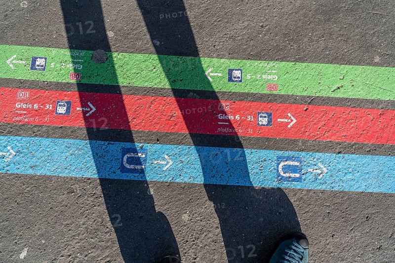 Signpost on the pavement, for bus and train diversions at Dortmund Central Station, during construction work, North Rhine-Westphalia, Germany, Europe