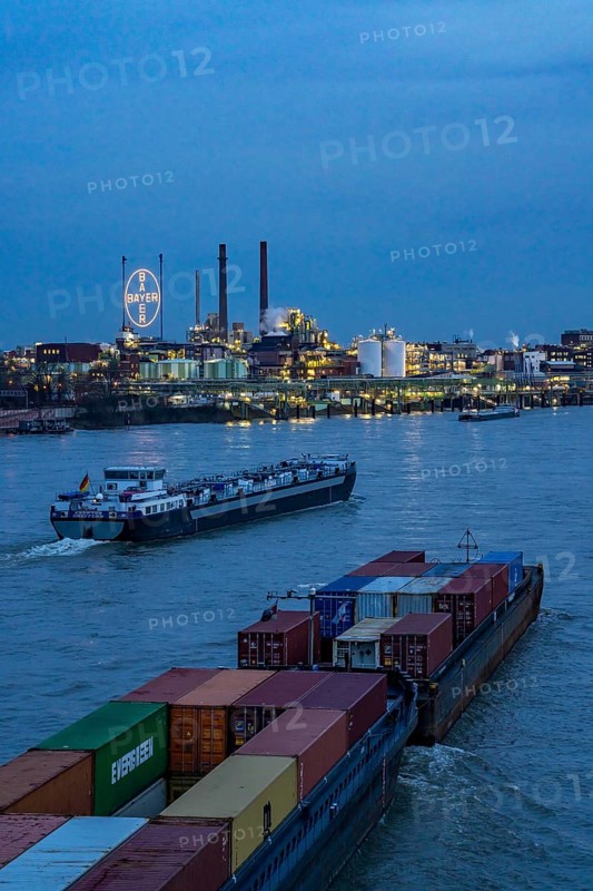 Backdrop of Chempark Leverkusen, Bayer Leverkusen, chemical park, chemical plant, river Rhine, cargo ship, Leverkusen, North Rhine-Westphalia, Germany, Europe