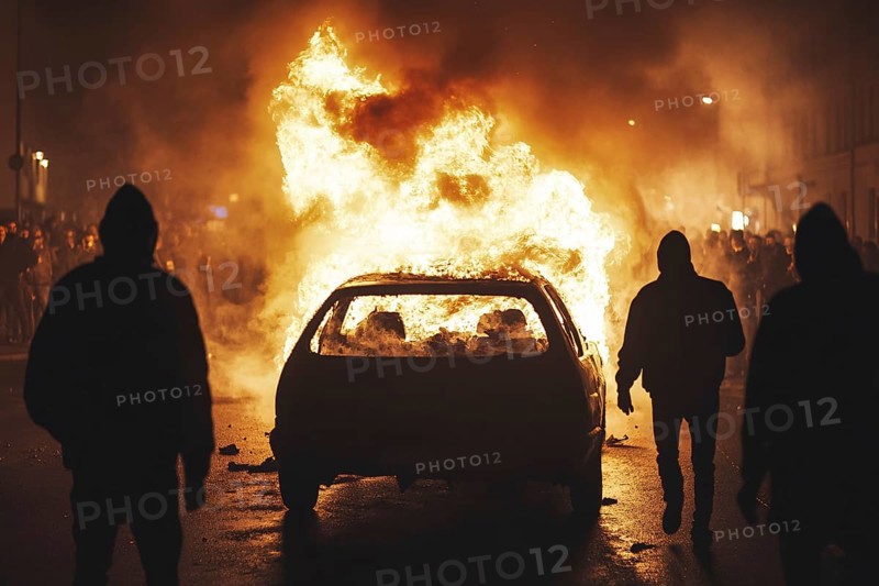 Rioting people in street with burning car. Generative Ai, AI generated