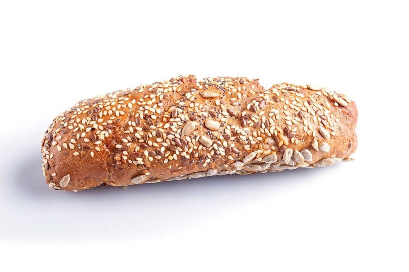 Rye bread with sunflower seeds, sesame and flax isolated on white. close up