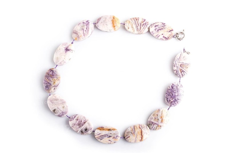 Agate colored beads isolated on white background. top view, close up