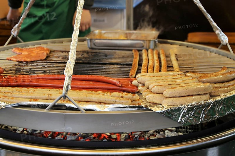 Sausages and steaks on the swing grill