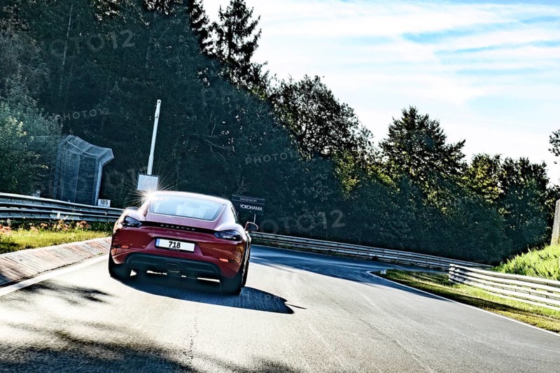View from perspective of racing driver on sports car Porsche Cayman driving on Nürburgring race track historic Nordschleife Green Hell international official race track for motorsport in right turn from track section Galgenkopf on former country roads in low mountain range Eifel, Nürburg, Rhineland-Palatinate, Germany, Europe