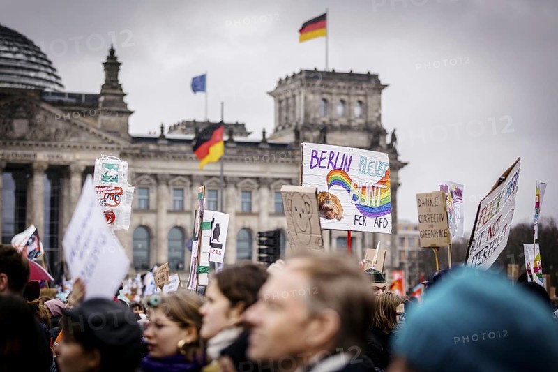 Posters at the large demonstration against the right in Berlin under the slogan We are the firewall . Taken in Berlin, 03.02.2024