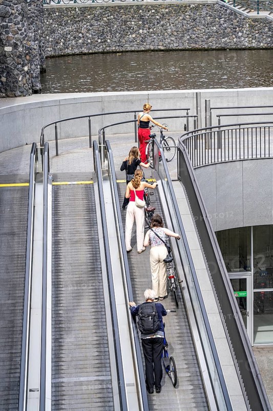 New bicycle car park at Amsterdam Central Station, Stationsplein, space for around 7000 bicycles, largest in Amsterdam, digitally monitored, underground, direct connection to the station and metro, Netherlands, escalators lead to the bicycle garage, Netherlands