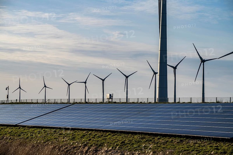 Solar park on the Slaperdijk dyke near the Eemshaven, test project, 17, 000 solar modules were installed over a good 5 kilometres, the Netherlands has over 22, 000 kilometres of dyke line, here it is being tested whether such an installation is successful and can be expanded, wind farm, Groningen, Netherlands