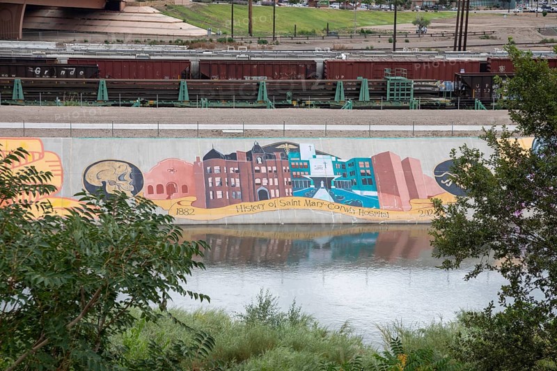 Pueblo, Colorado, Murals line a concrete levee for three miles along the Arkansas River. The levee was built after a disastrous 1921 flood. Students painted unauathorized murals in the 1970s, but the artwork has since become accepted as the Pueblo Levee Mural Project