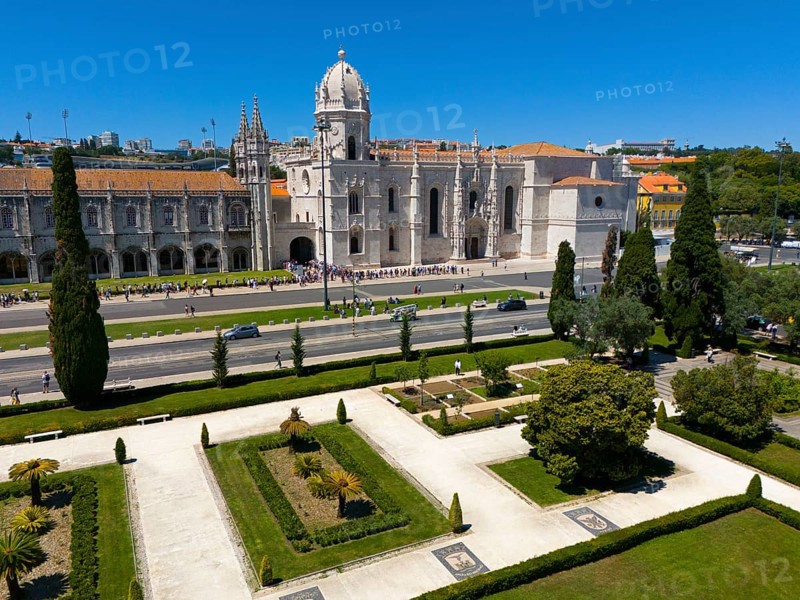 Gothic church with surrounding gardens and green areas next to a street under a clear blue sky, aerial view, Hieronymus Monastery, Mosteiro dos Jerónimos, Hieronymite Monastery, World Heritage Site, Monastery Church of Santa Maria, Belém, Belem, Bethlehem, Lisbon, Lisboa, Portugal, Europe