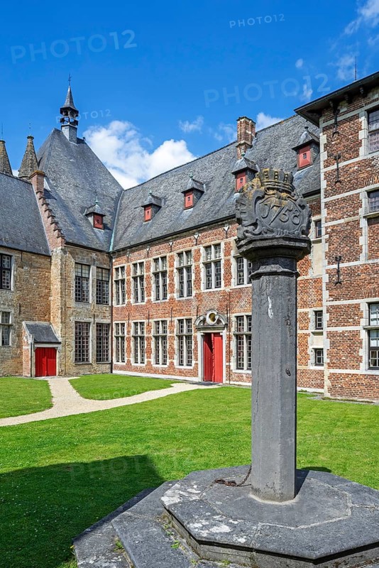 1758 pillory in courtyard at Kasteel van Laarne, 14th century medieval moated castle near Ghent, East Flanders, Belgium, Europe