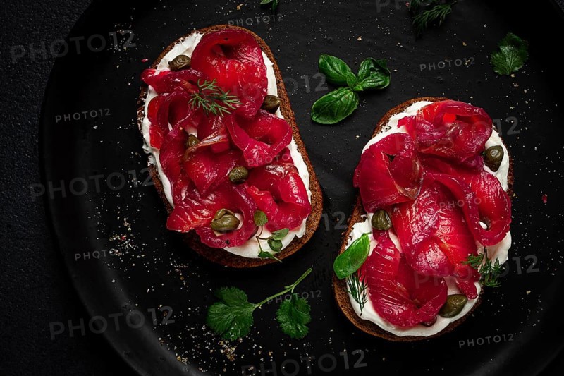 Sandwiches with gravlax salmon, cream cheese, capers, greens, breakfast, homemade