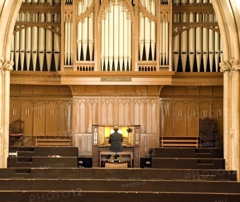 Man playing organ, St Andrews Hall, Norwich, Norfolk, England, UK