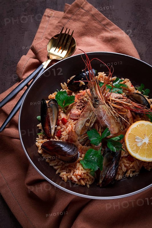Seafood paella, shrimp and mussels risotto, rice, homemade, top view, no people