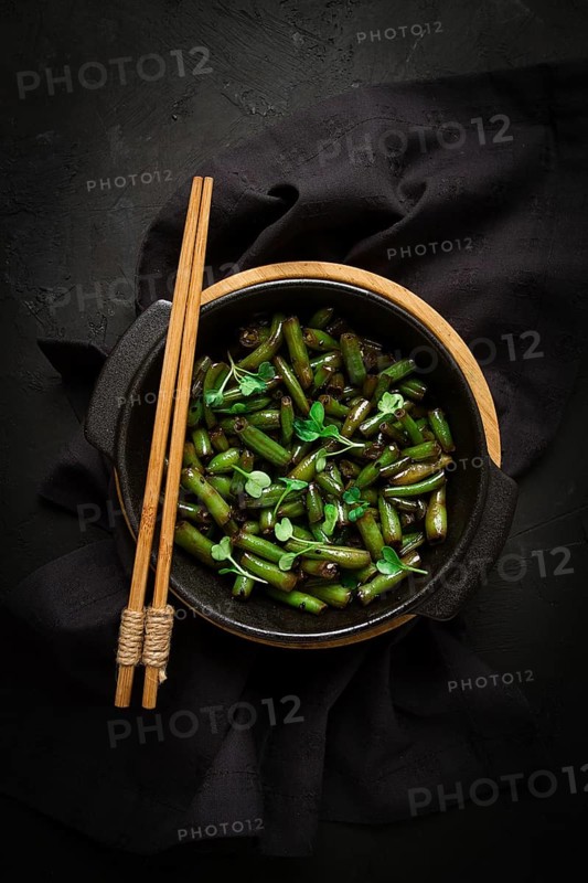 Fried bean pods, in soy sauce, with sesame seeds, homemade, no people