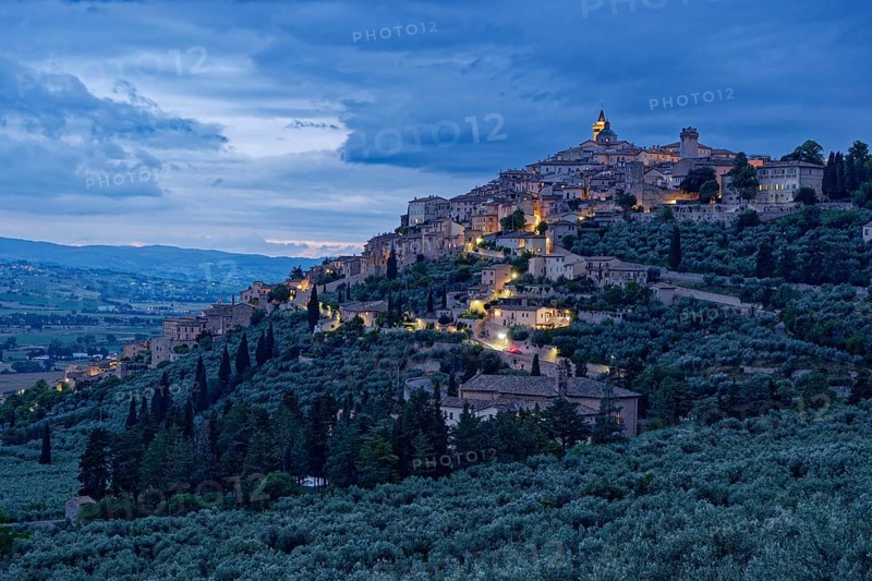 Trevi, illuminated at dusk, is a small Italian town in the province of Perugia in Umbria and a member of the Association of the Most Beautiful Places in Italy. Italy, Southern Europe