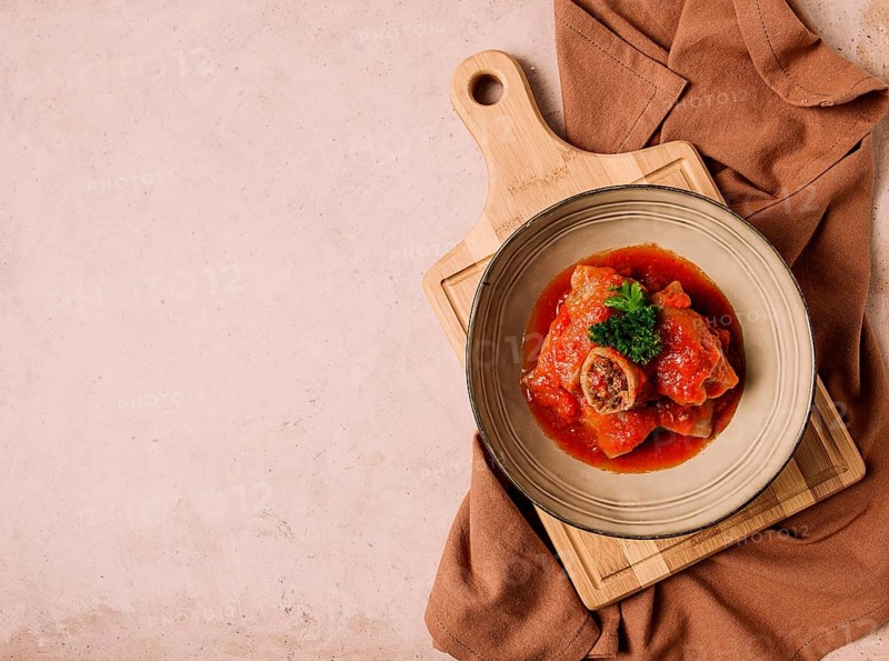 Stuffed cabbage rolls, with minced meat, in tomato sauce, on a beige background, food and drink, healthy eating, healthy lifestyle, cuisine, rustic, cabbage roll, top view, no people
