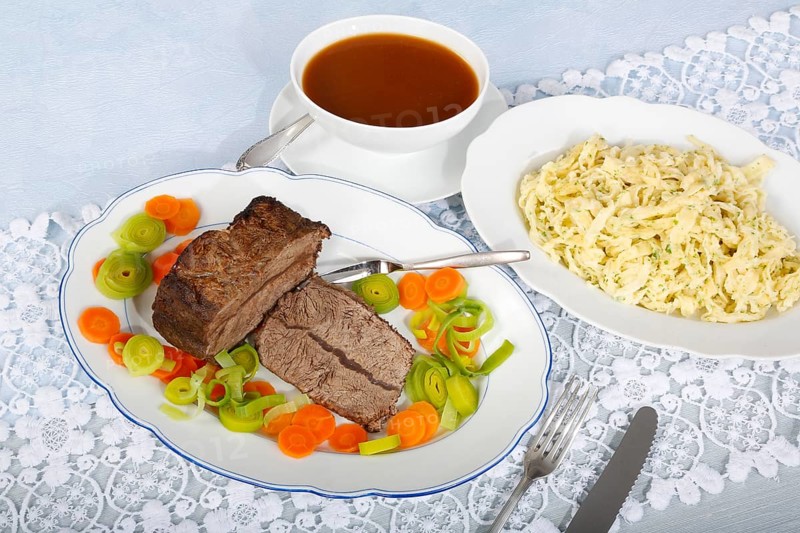 Swabian cuisine, roast beef, roast ox, herb spaetzle, meat dish, gravy, carrot vegetables, leek, serving platters, hearty, savoury, typical Swabian, home cooking, traditional cuisine, food photography, studio, Germany, Europe