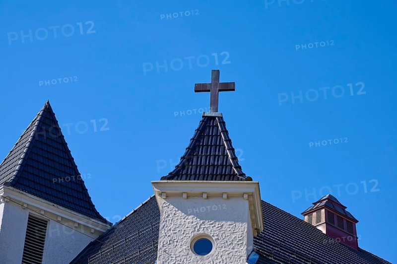 Church towers with cross and roof in front of a clear blue sky, Bryggen, Bergen, Vestland, Norway, Europe