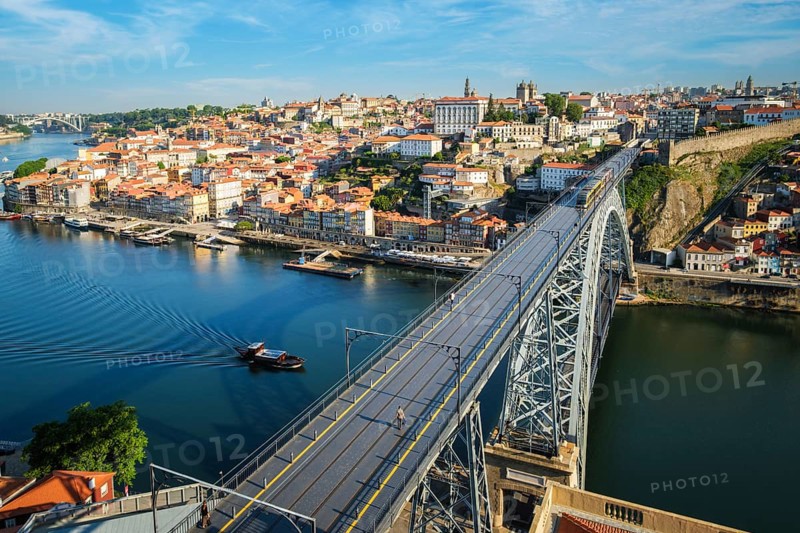 View of Porto city and Douro river and Dom Luis bridge I with metro tram from famous tourist viewpoint Miradouro da Serra do Pilar. Porto, Vila Nova de Gaia, Portugal, Europe