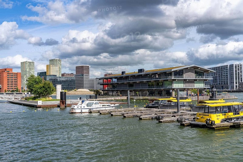 The Floating Office Rotterdam, is considered the world's largest floating office building, first part of the floating park, in the Rijnhaven, 28ha harbour basin, has now been filled in by almost a third to create space for up to 3000 flats, there will be an artificial beach, a floating park connected by jetties, restaurants and shops, cultural facilities, a major urban development project in the old harbour, the Rijnhaven is adjacent to the popular districts of Kop van Zuid and Katendrecht, Rotterdam, Netherlands