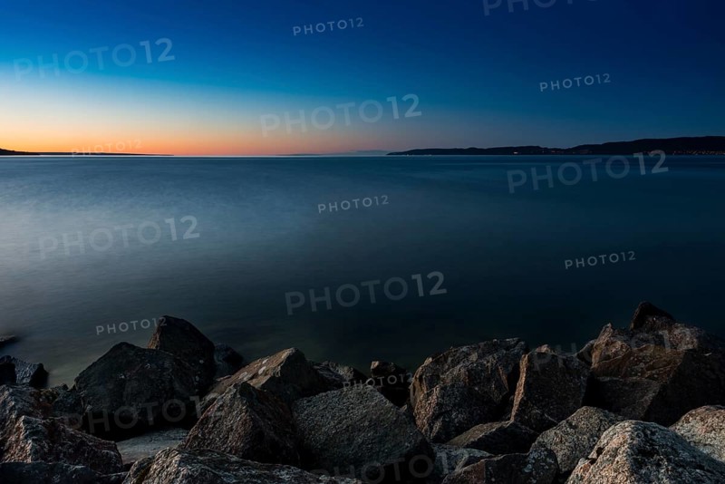 Lake Vättern in the evening light, lake, water, inland waters, inland lake, calm, evening light, sunset, evening sun, long exposure, emotion, romantic, mood, romance, stone, shore, silence, melancholy, nature, blue hour, fresh water, climate, Jönköping, Sweden, Scandinavia, Europe