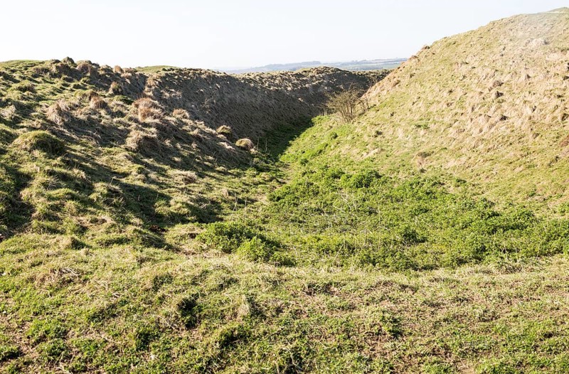 Defensive ditch and rampart at Barbury Castle Country Park, Iron Age hill fort, Wiltshire, England, UK