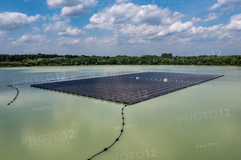 Germany's largest floating solar power plant on the Silbersee III, a quarry pond no longer used for sand mining, near Haltern am See, operated by Quarzwerke GmbH, around 5800 solar modules, on an area of a good 2 football pitches, generate 3.1 megawatts of power, the company uses the electricity itself on weekdays, at weekends it flows into the public grid, North Rhine-Westphalia, Germany, Europe
