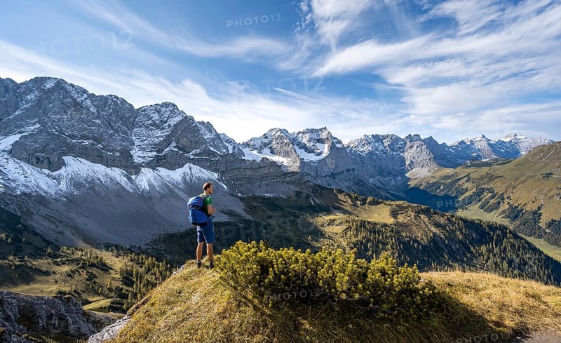 Mountaineer enjoying the view, mountain panorama with rocky steep peaks, view of summit Laliderspitze, Dreizinkenspitze and Spritzkarspitze, hike to the summit of Hahnkampl, Engtal, Karwendel, Tyrol, Austria, Europe