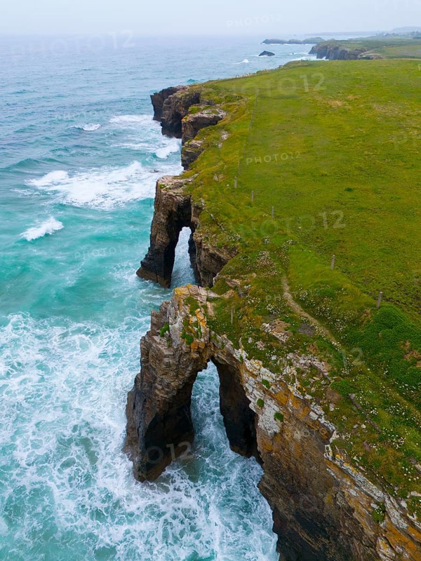 Steep coastline with characteristic rock arches and thundering waves crashing against the rocks, aerial view, Praia das Catedrais, Playa de las Catedrales, Cathedral beach, As Catedrais beach, Cantabrian Sea, Ribadeo, Galicia, Galicia, Spain, Europe