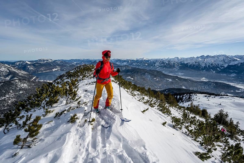Ski tourer at the summit of Simetsberg, mountain panorama, Estergebirge, Bavarian Prealps, Bavaria Germany