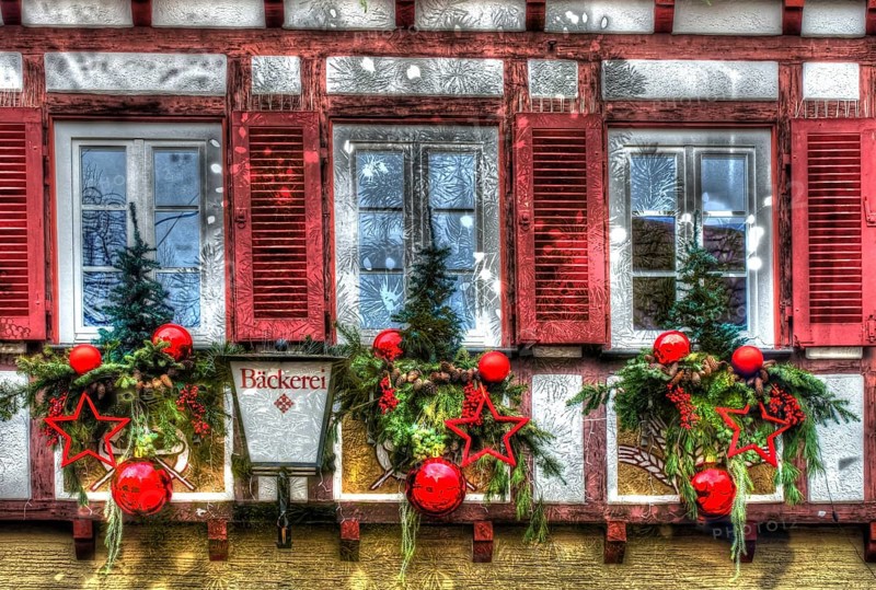House facade with Christmas decoration, window, window shutters, half-timbered, Christmas motif, Christmas, Christmas festival, Advent season, red Christmas baubles, jewellery, Advent season, artistic photography, alienation, Christmas card motif, creative photography, all over, allover pattern, half-timbered house, light, lamp with writing, letters, bakery, Bäckerei Berger, Reutlingen, Baden-Württemberg, Germany, Europe