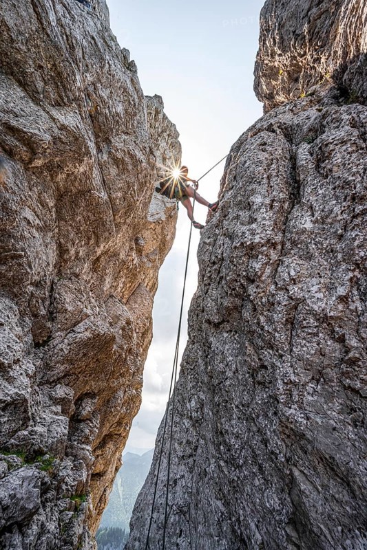 Climber on a climbing tour, abseiling, alpine climbing, crossing the Kampenwand, Sonnenstern, Chiemgau, Bavaria, Germany, Europe