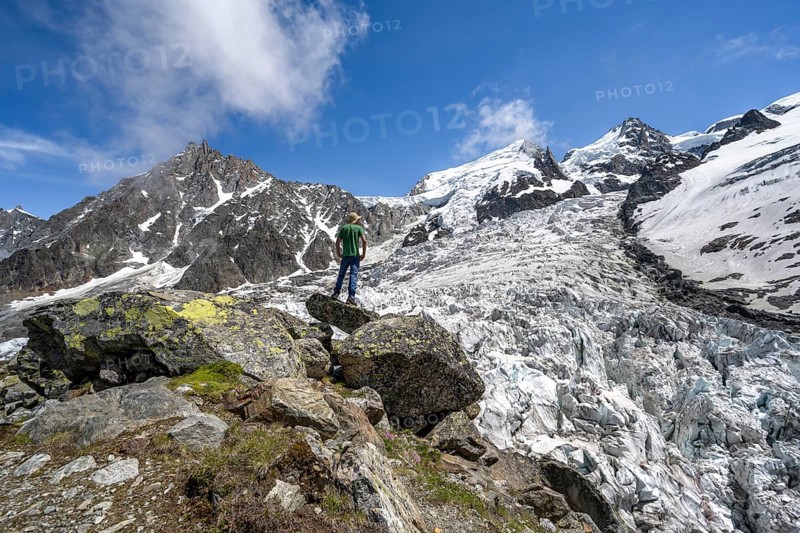 Mountaineers on the glacier, High alpine glaciated mountain landscape, La Jonction, Glacier des Bossons meets Glacier de Taconnaz, Summit of the Aiguille du Midi, Mont Maudit and Mont Blanc, Chamonix, Haute-Savoie, France, Europe