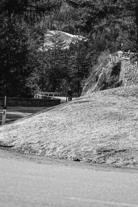 Road bike rider in spring in the Allgäu against the picturesque backdrop of the Alps, Bavaria, Germany, Europe