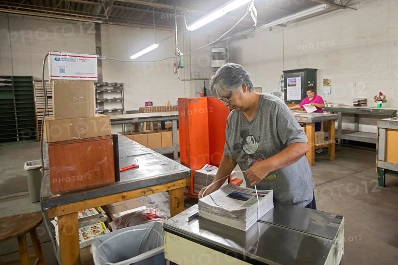 Liberal, Kansas, Lisa Diaz bundles copies of the Kiowa County (Colorado) Independent. The Independent is one of many local newspapers from four states printed in the Liberal Leader & Times' printing plant. The Leader & Times hopes this will help keep local journalism alive. Across the country, more than 2, 000 local newspapers have closed in recent years
