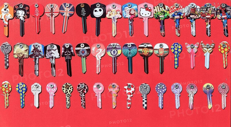 Display rows of picture Yale keys on red background, UK