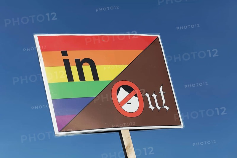 Coloured banner with Hitler pictogram, colourful is in, brown is out, large demonstration against right-wing extremism and AfD on 27.1.2024 n in Düsseldorf, North Rhine-Westphalia, Germany, Europe