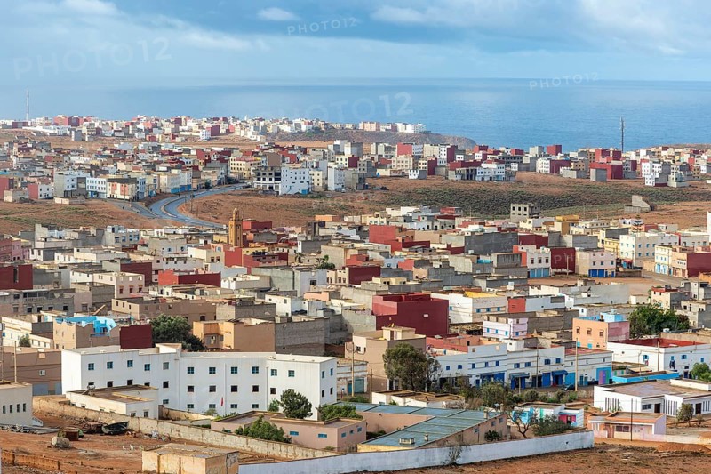 Oblique view over coastal town to Atlantic Ocean, Mirleft, southern Morocco, North Africa