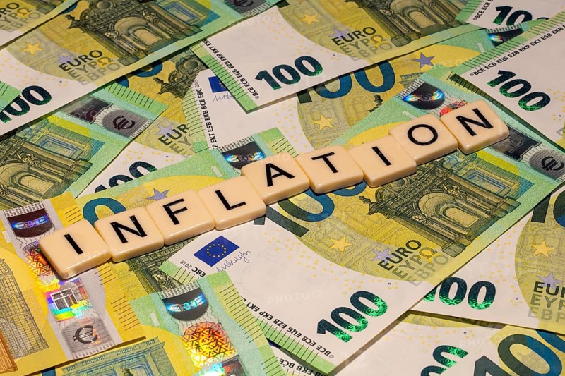 Symbolic image of inflation: letters on euro notes show the word inflation