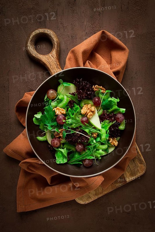 Fresh salad, waldorf, celery stalk, with apple and walnut, grapes, herbs, homemade, no people