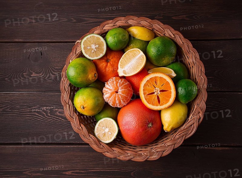 Assortment, citrus fruits, in a basket, close-up, top view, no people