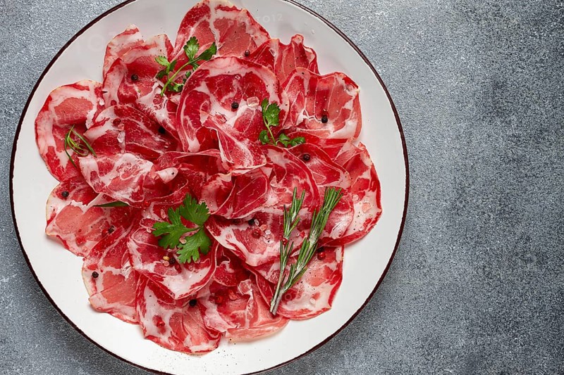 Sliced cured ham, prosciutto, italian dish, delicacy, parma ham, top view, no people