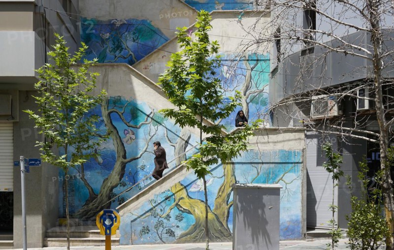 Passers-by walk up a painted staircase in Tehran. The city of Tehran is changing the image of the city through art objects in public spaces, 17.05.2016