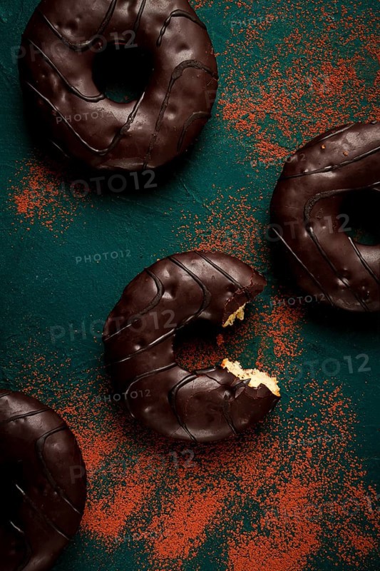 Donuts with cocoa, in chocolate glaze, top view, no people