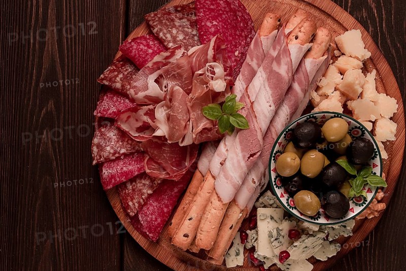 Appetizer, assortment, set, sausage, and cheese, on a wooden board, top view, no people