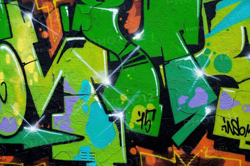 Vivid green graffiti with yellow accents on a wall, Landau, Rhineland-Palatinate, Germany, Europe
