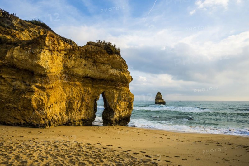 Rocky coast with beach and red rocks, Praia do Camilo, Lagos, Algarve, Portugal, Europe