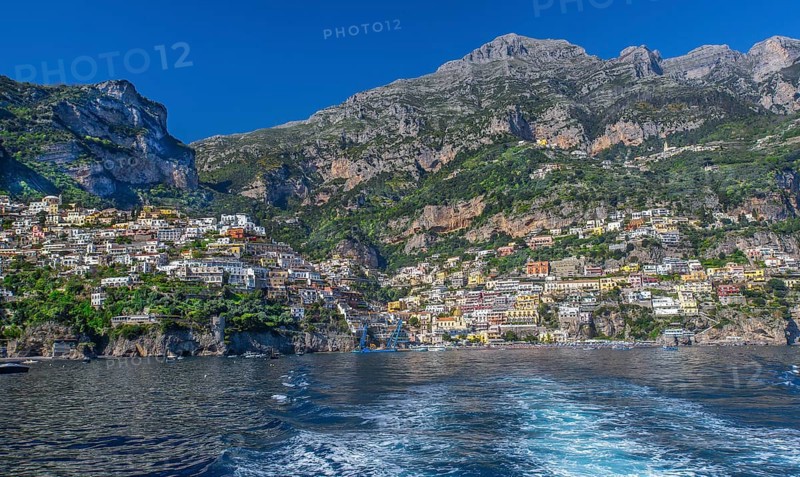 View from the boat of the village on the cliffs above the sea, Positano, Amalfi Coast, Amalfitana, Campania, Italy, Europe