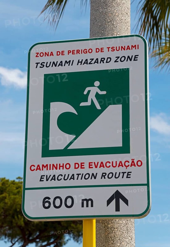 Warning sign for a tsunami danger zone near the beach with evacuation notice, Vilamoura, Faro, Algarve, Portugal, Europe