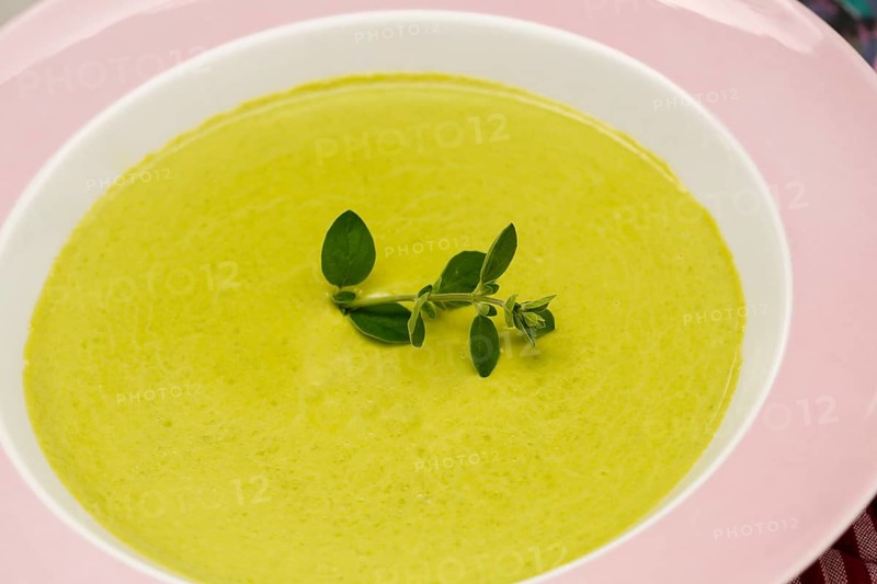 South German cuisine, pea soup, soup arranged in a plate, herbs, savoury, salty, traditional cuisine, food photography, studio, Germany, Europe